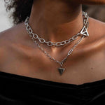 Female wearing affirmations silver necklace stacked with the believe in yourself chunky necklace 